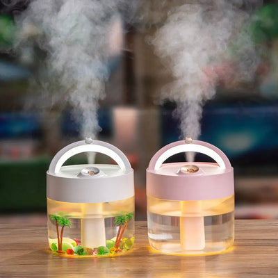 Two colorful decorative humidifiers with light, releasing soothing mist in a stylish design